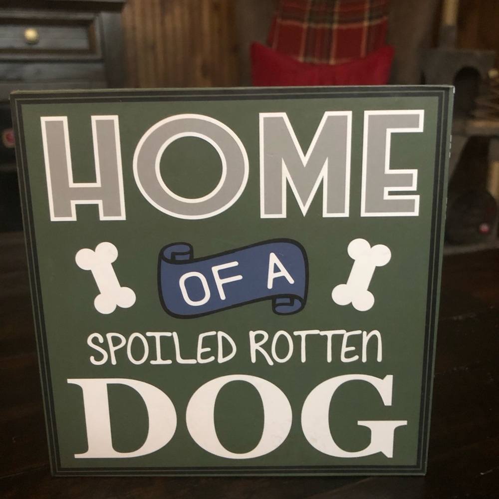 Small wooden sign “home of a spoiled rotten dog”